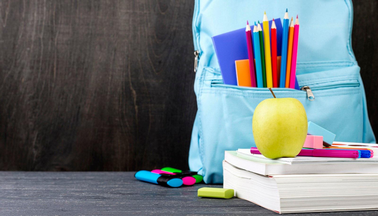 front-view-back-school-stationery-with-colorful-pencils-apple